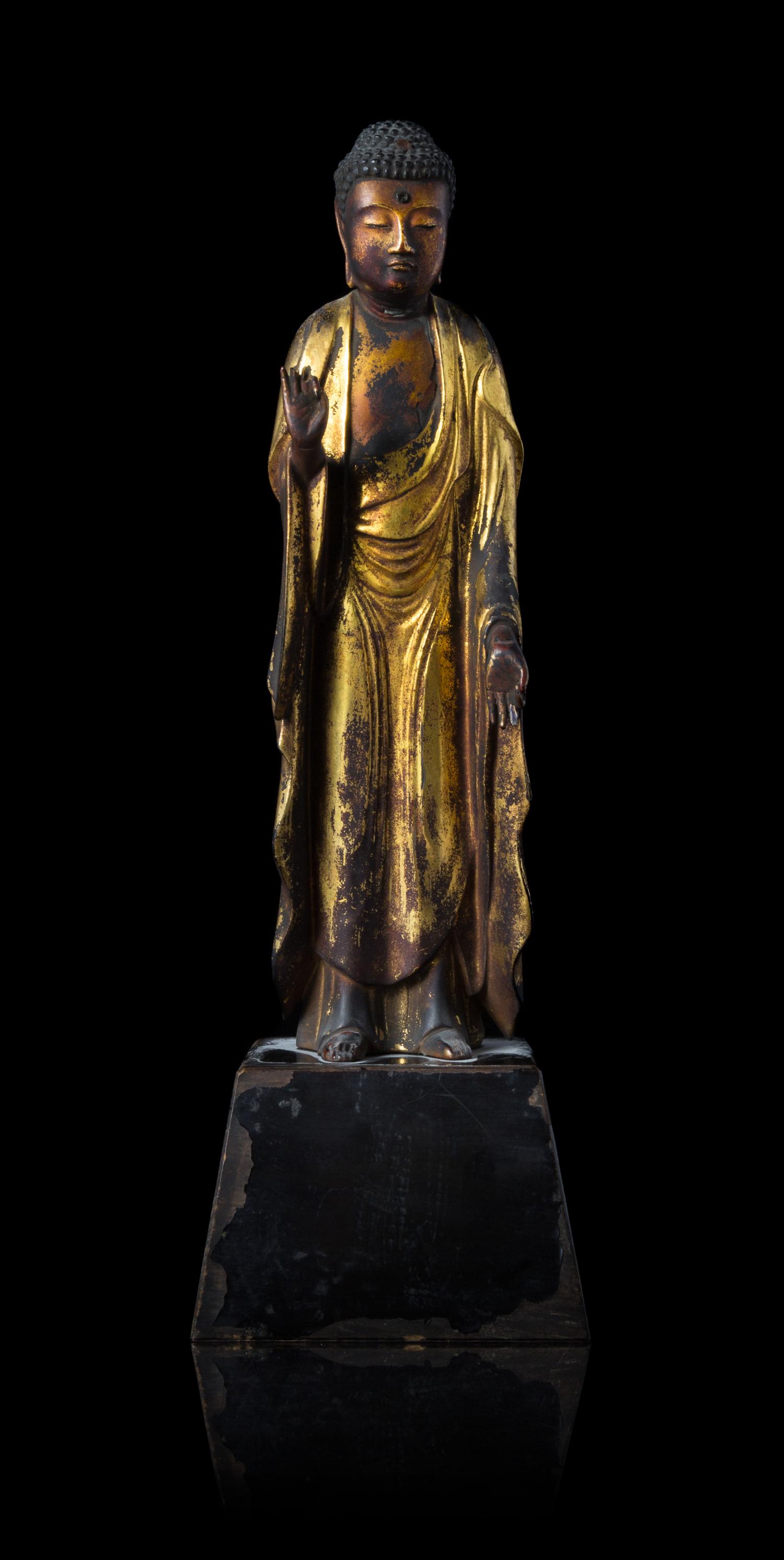 A Gilt Lacquered Wood Figure of Standing Buddha