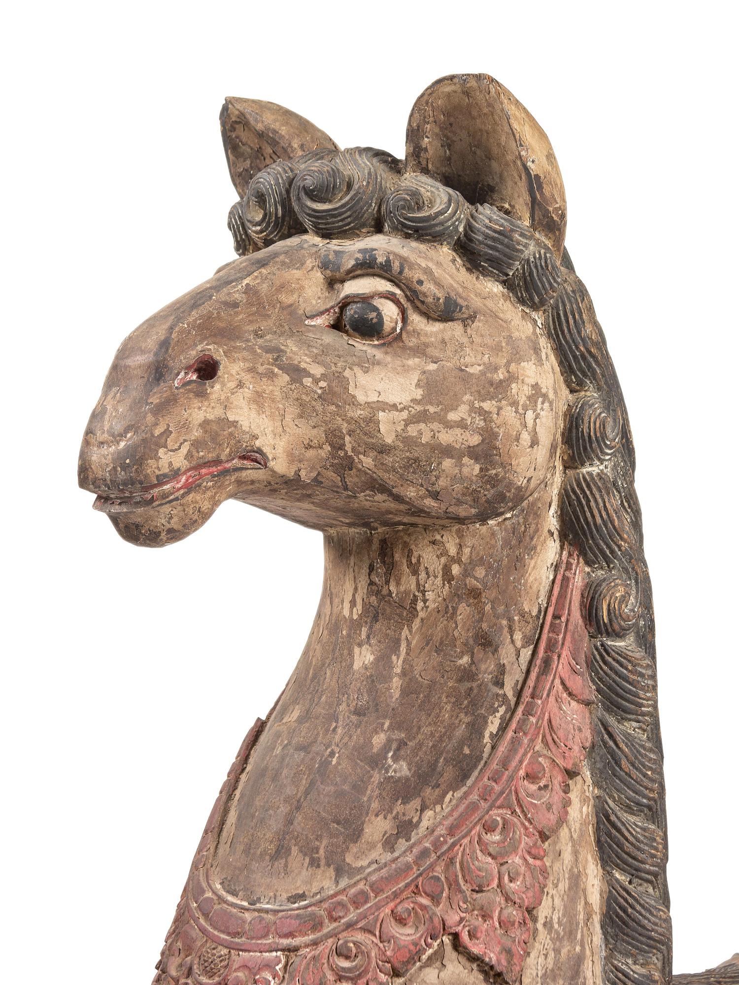 A Pair of Large Balinese Carved and Polychrome Decorated Models of Hippocampi