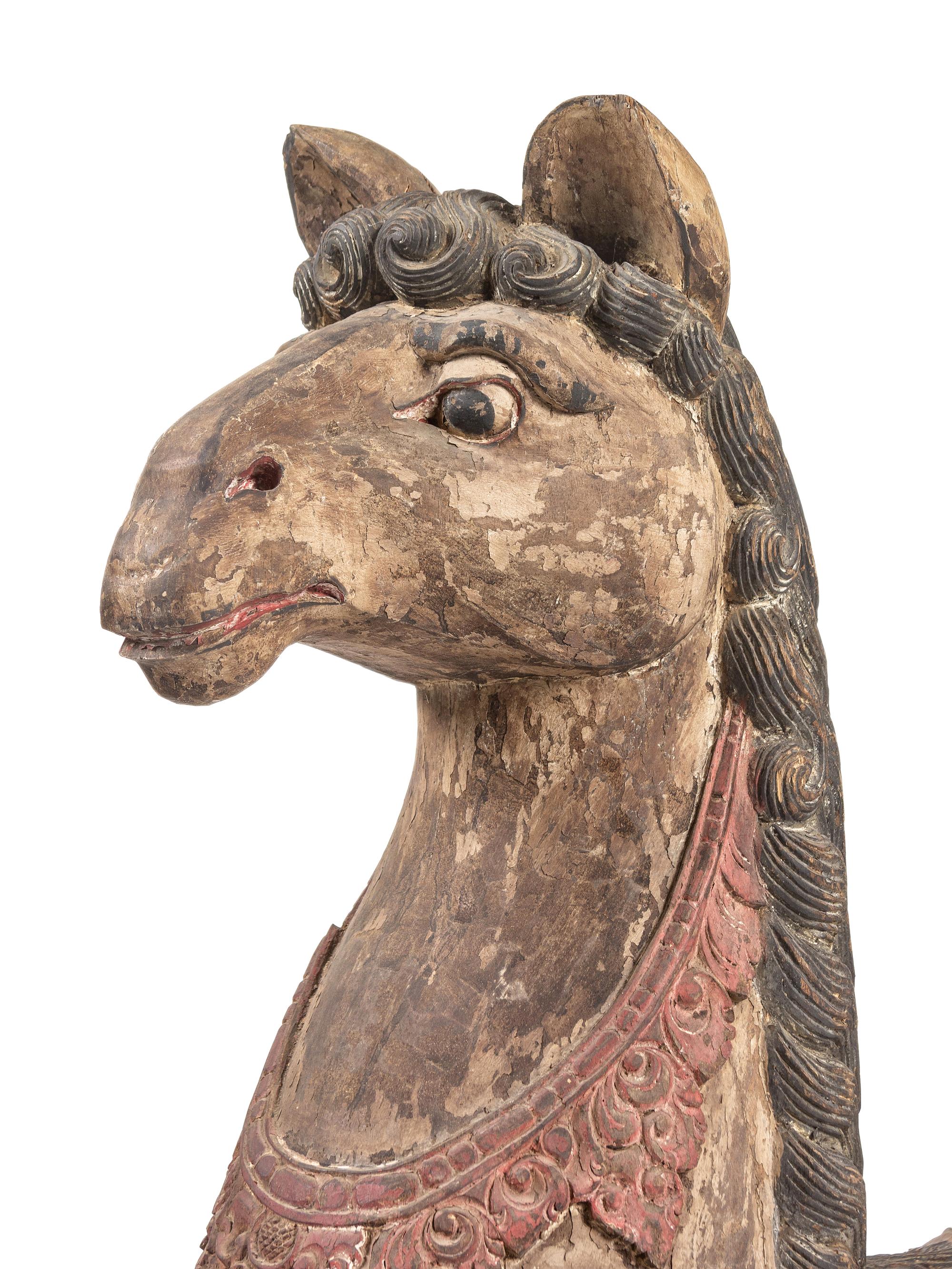 A Pair of Large Balinese Carved and Polychrome Decorated Models of Hippocampi