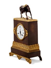 An Empire Style Gilt and Patinated Bronze Mantel Clock