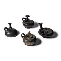 Four Greek Black-Glazed Vessels