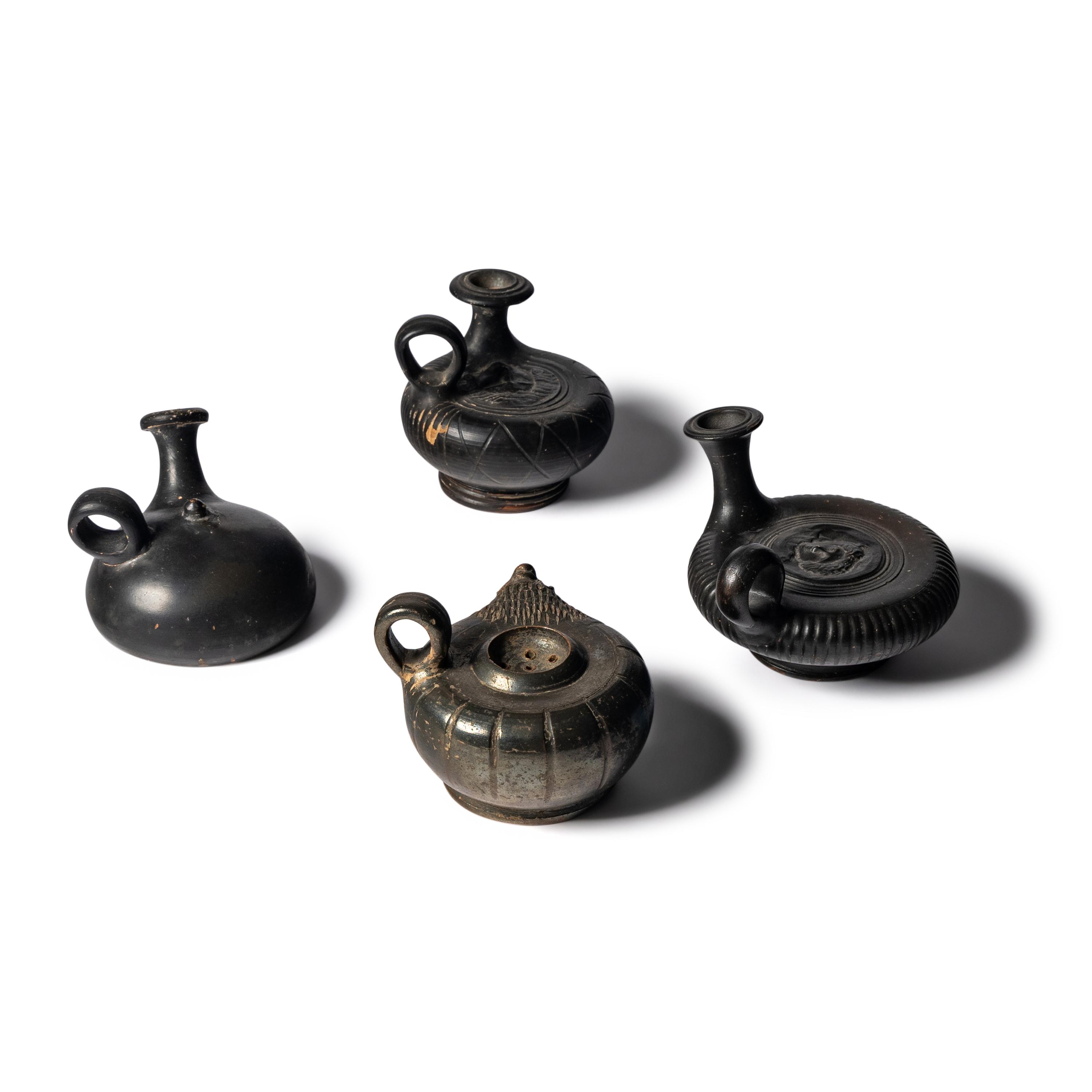 Four Greek Black-Glazed Vessels