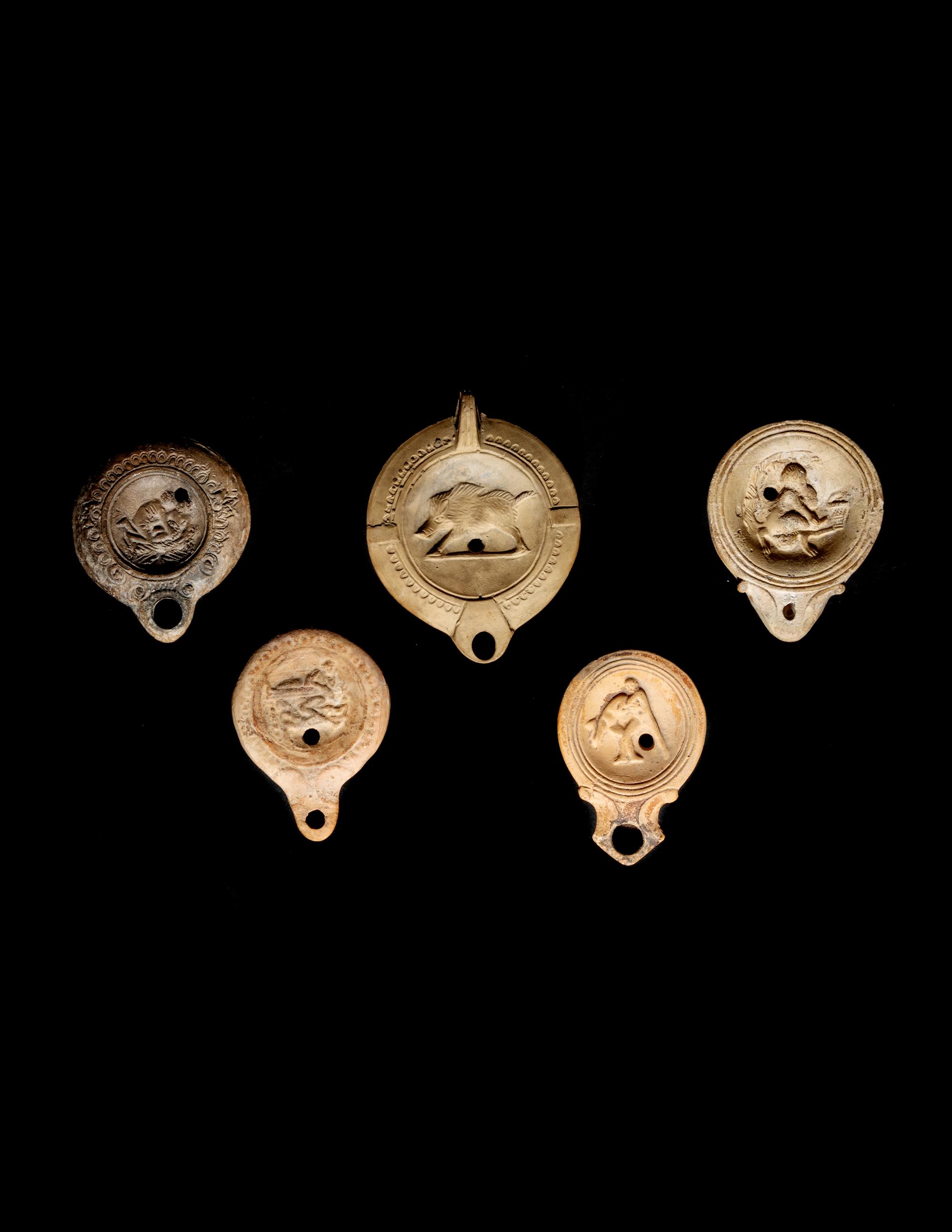 Five Roman Molded Terra Cotta Oil Lamps