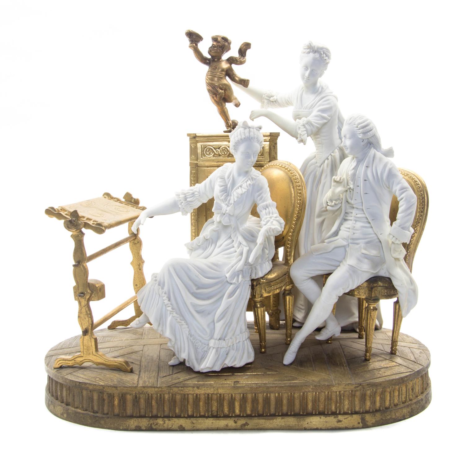 A French Gilt Bronze and Sevres Style Bisque Porcelain Figural Group, Height 11 1/2 inches.