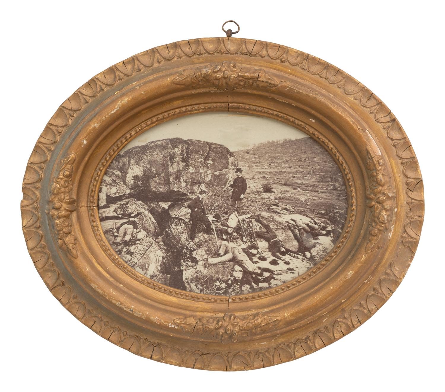 [CIVIL WAR]. Albumen photograph of a posed scene featuring deceased soldiers at Devil's Den, by Peter S. WEAVER.