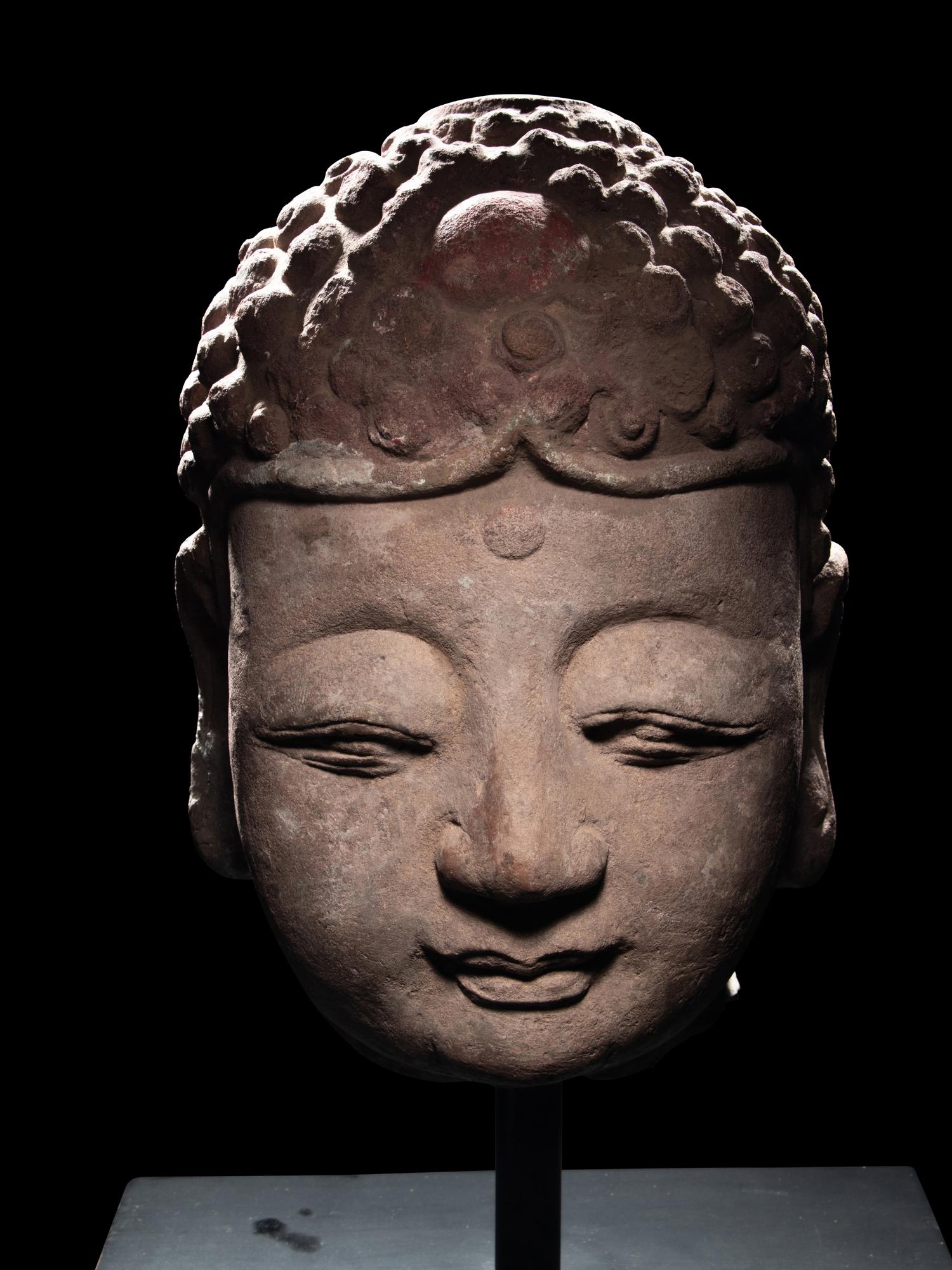 A Pair of Chinese Carved Stone Heads of Buddha