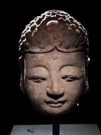 A Pair of Chinese Carved Stone Heads of Buddha