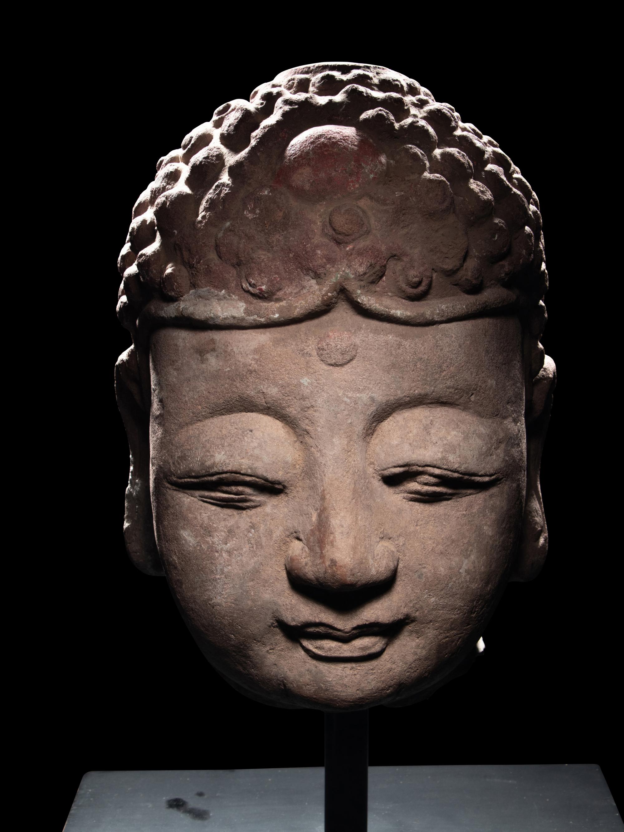 A Pair of Chinese Carved Stone Heads of Buddha