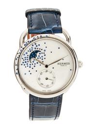 HERMÈS, REF. AR7.130 STAINLESS STEEL, DIAMOND, AND SAPPHIRE 'ARCEAU PETITE LUNE' MOONPHASE DATE WATCH