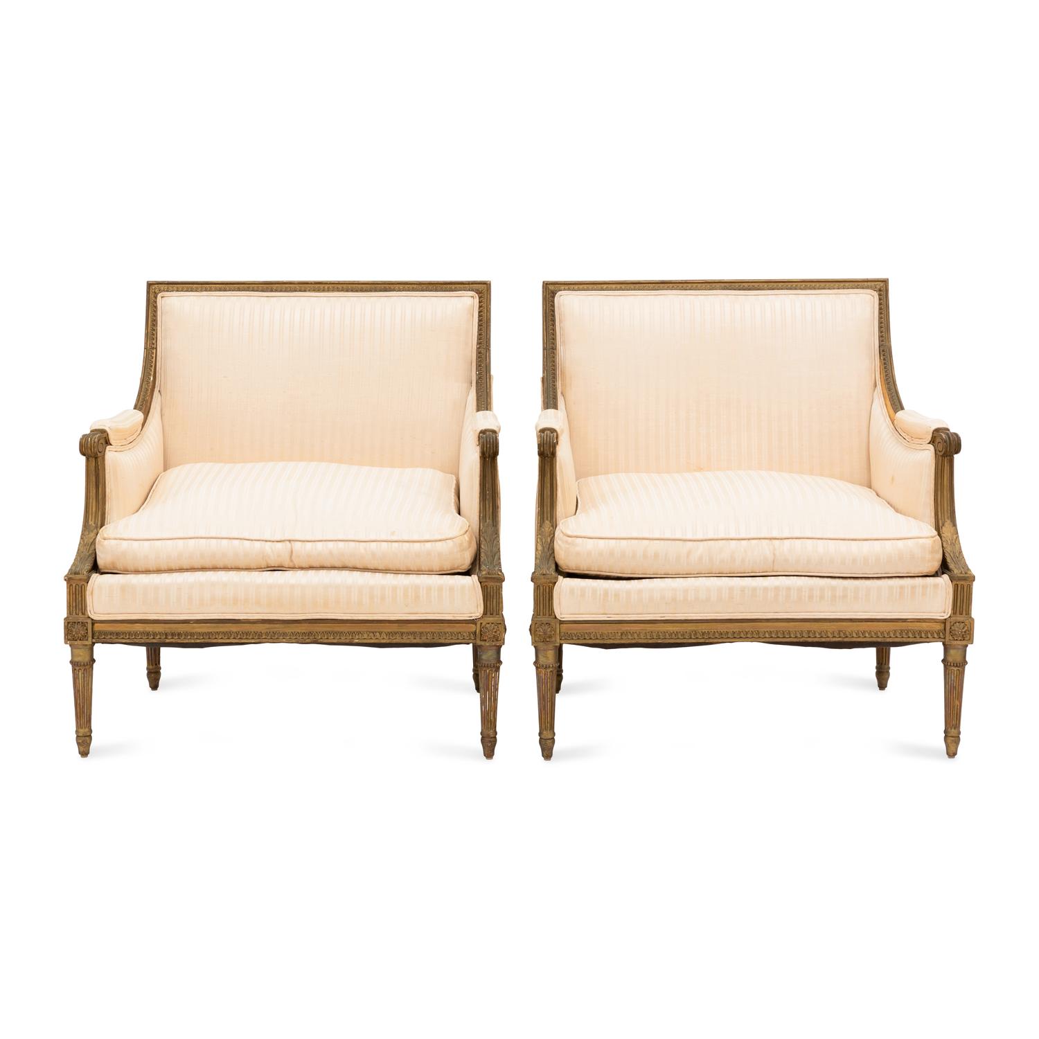 A Pair of Louis XVI Style Gilt Walnut and Upholstered Bergères