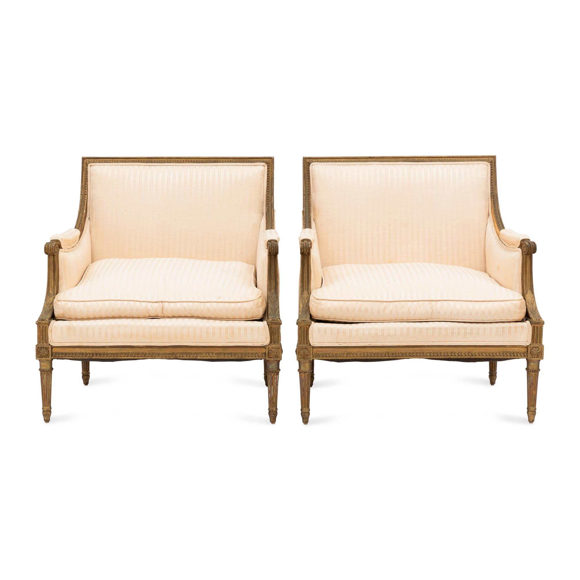 A Pair of Louis XVI Style Gilt Walnut and Upholstered Bergères