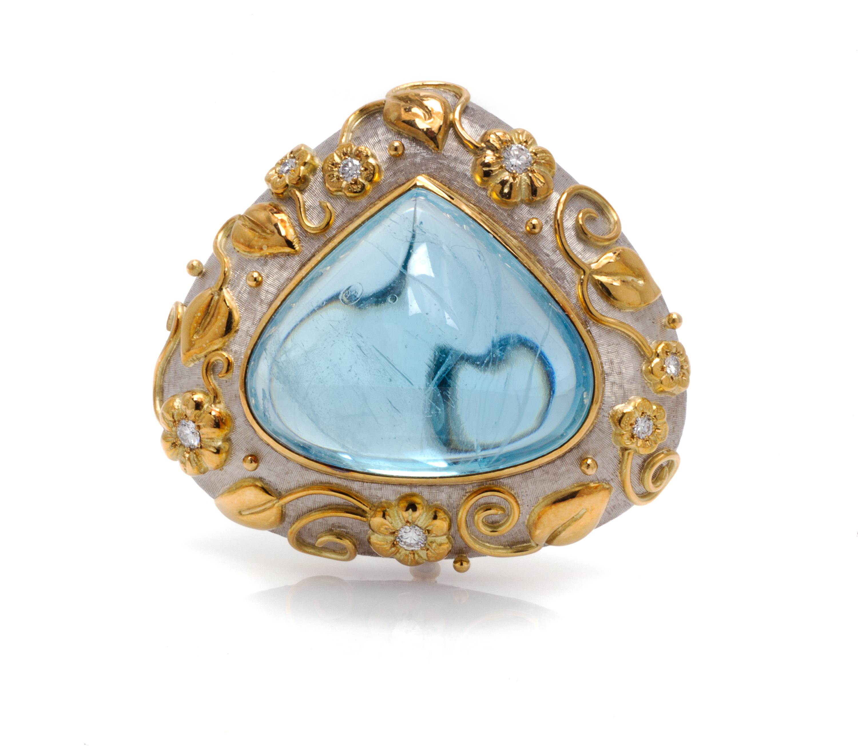 An 18 Karat Two Tone Gold, Aquamarine and Diamond Brooch, Elizabeth Gage, 44.30 dwts.
