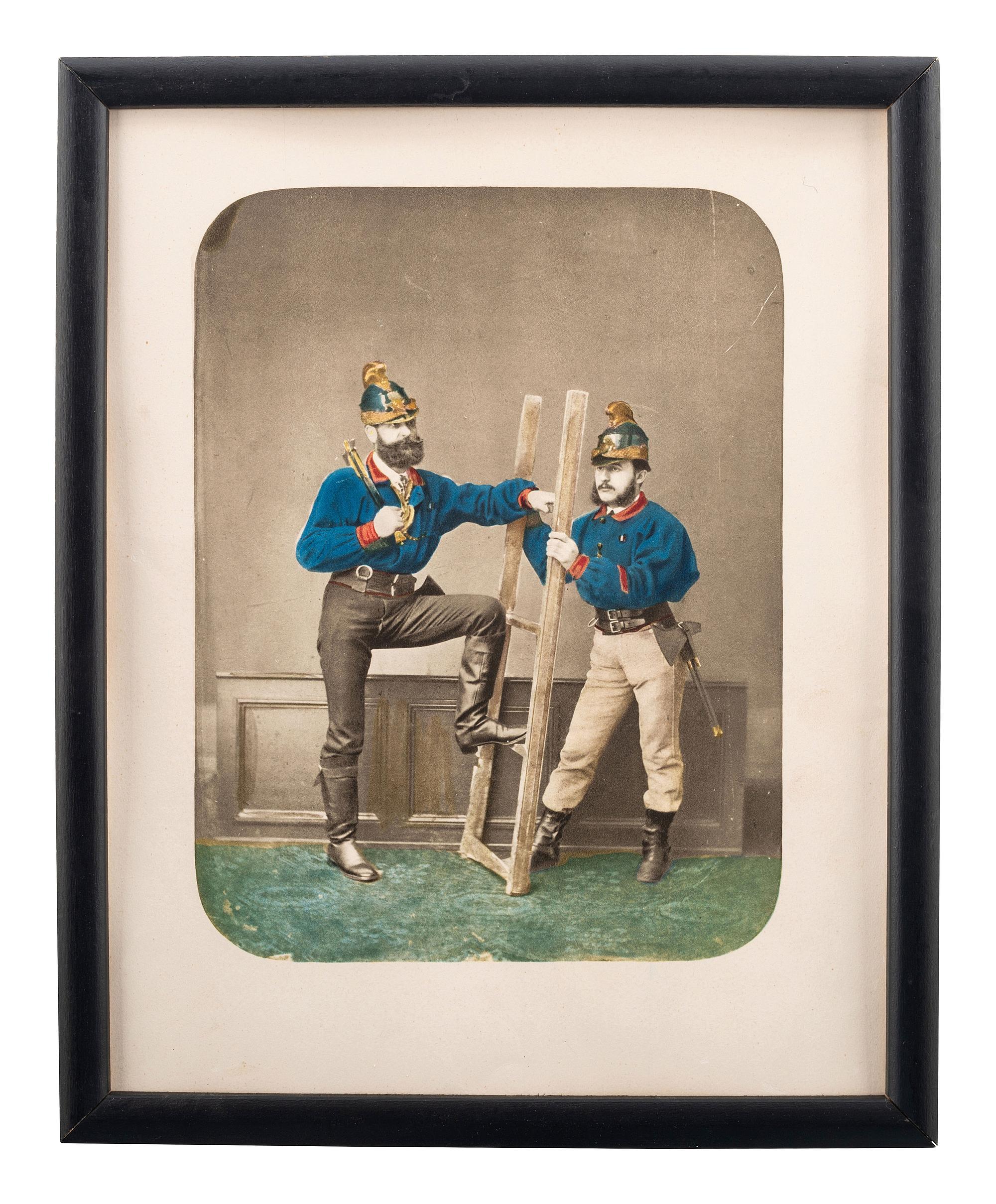 [EARLY PHOTOGRAPHY]. Hand-colored salt print of two firefighters.