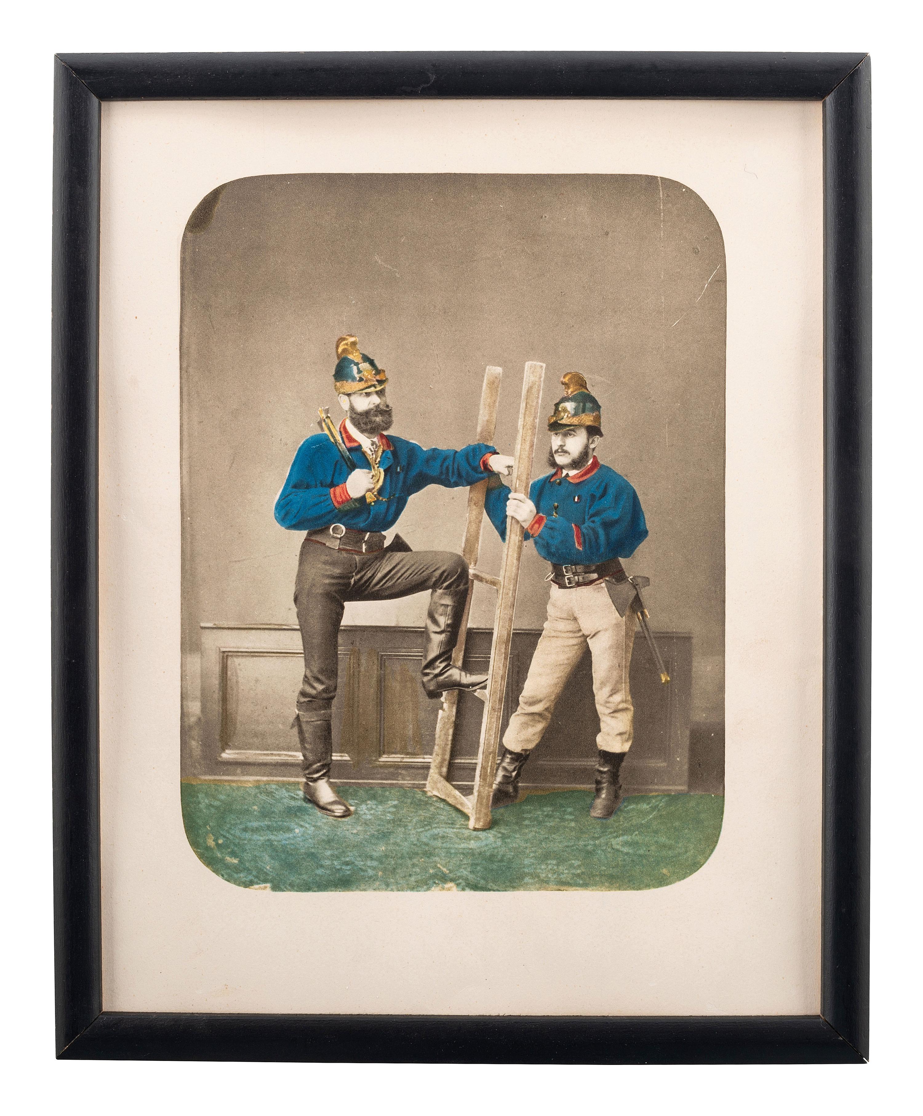 [EARLY PHOTOGRAPHY]. Hand-colored salt print of two firefighters.