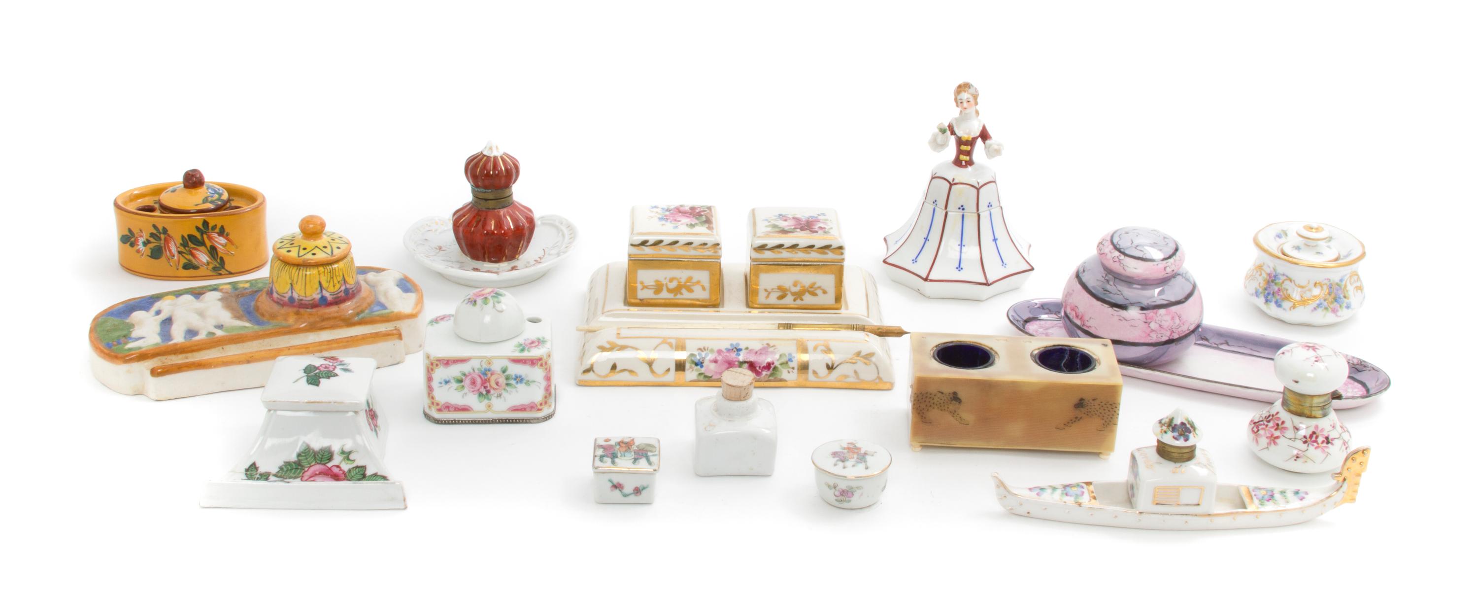 A Collection of Fifteen Inkwells, Width of widest stand 8 1/4 inches.