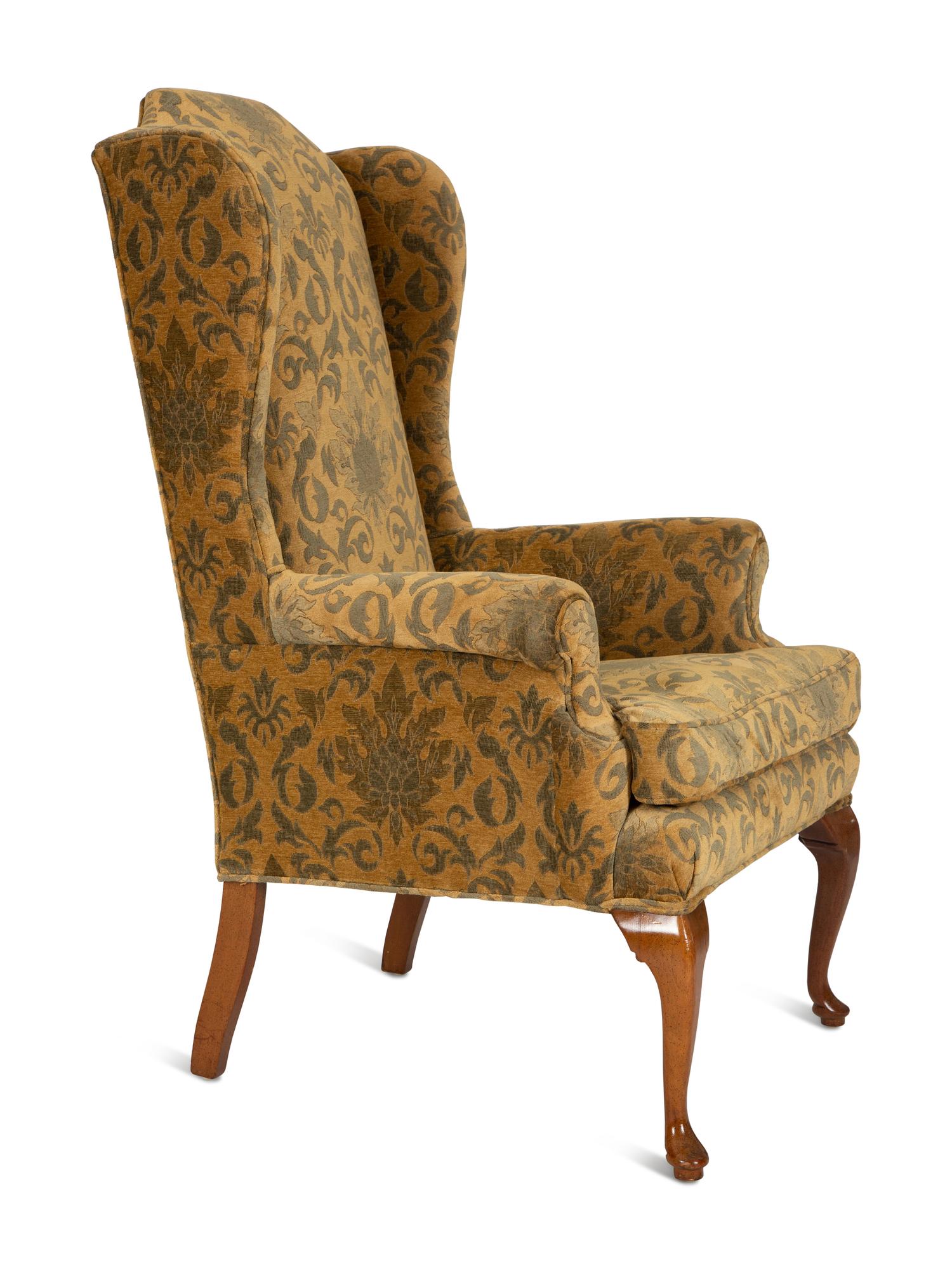 A Queen Anne Style Upholstered Wing Back Armchair — 20th Century