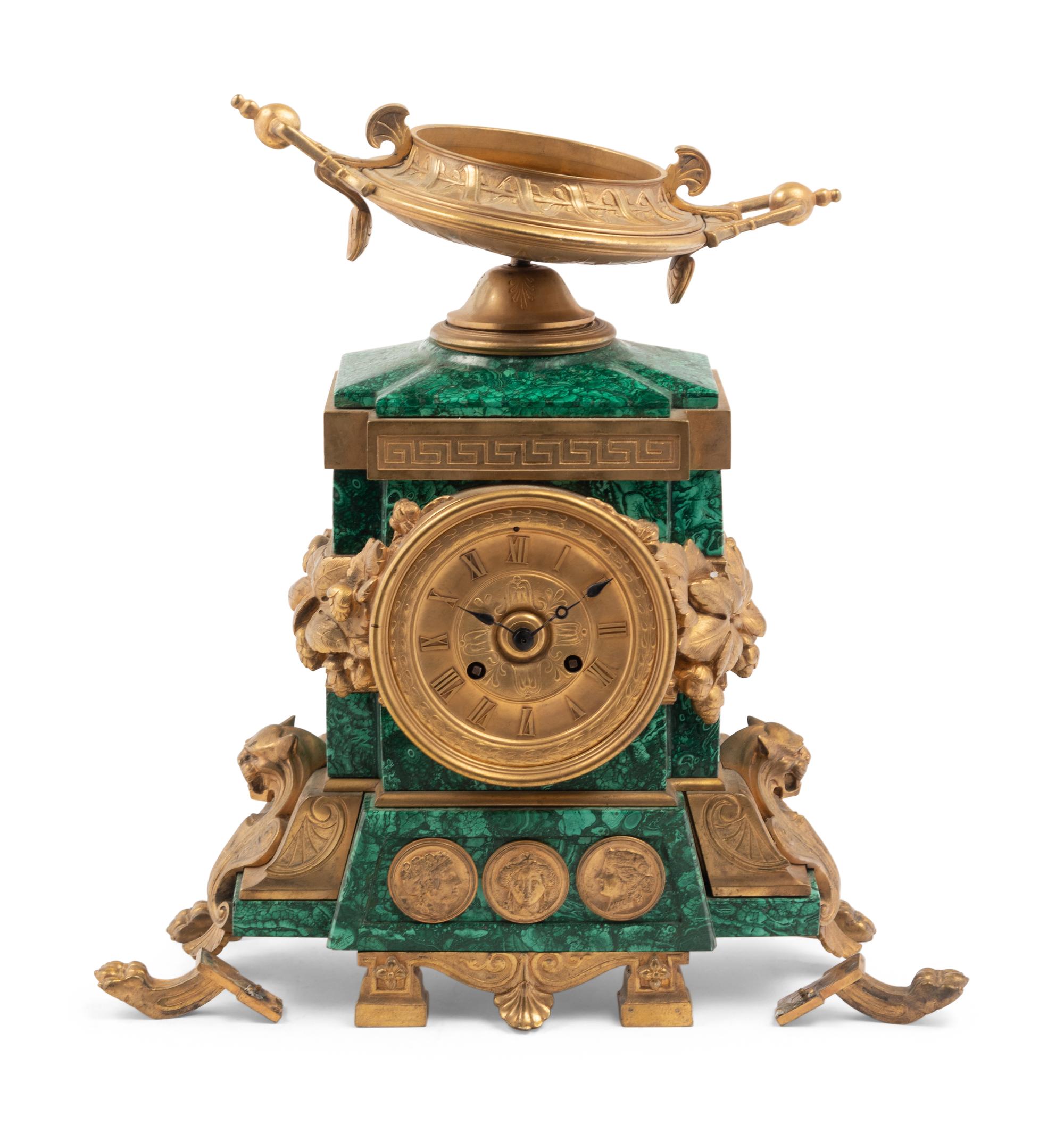 An Empire Style Gilt Bronze and Malachite Veneered Mantel Clock
