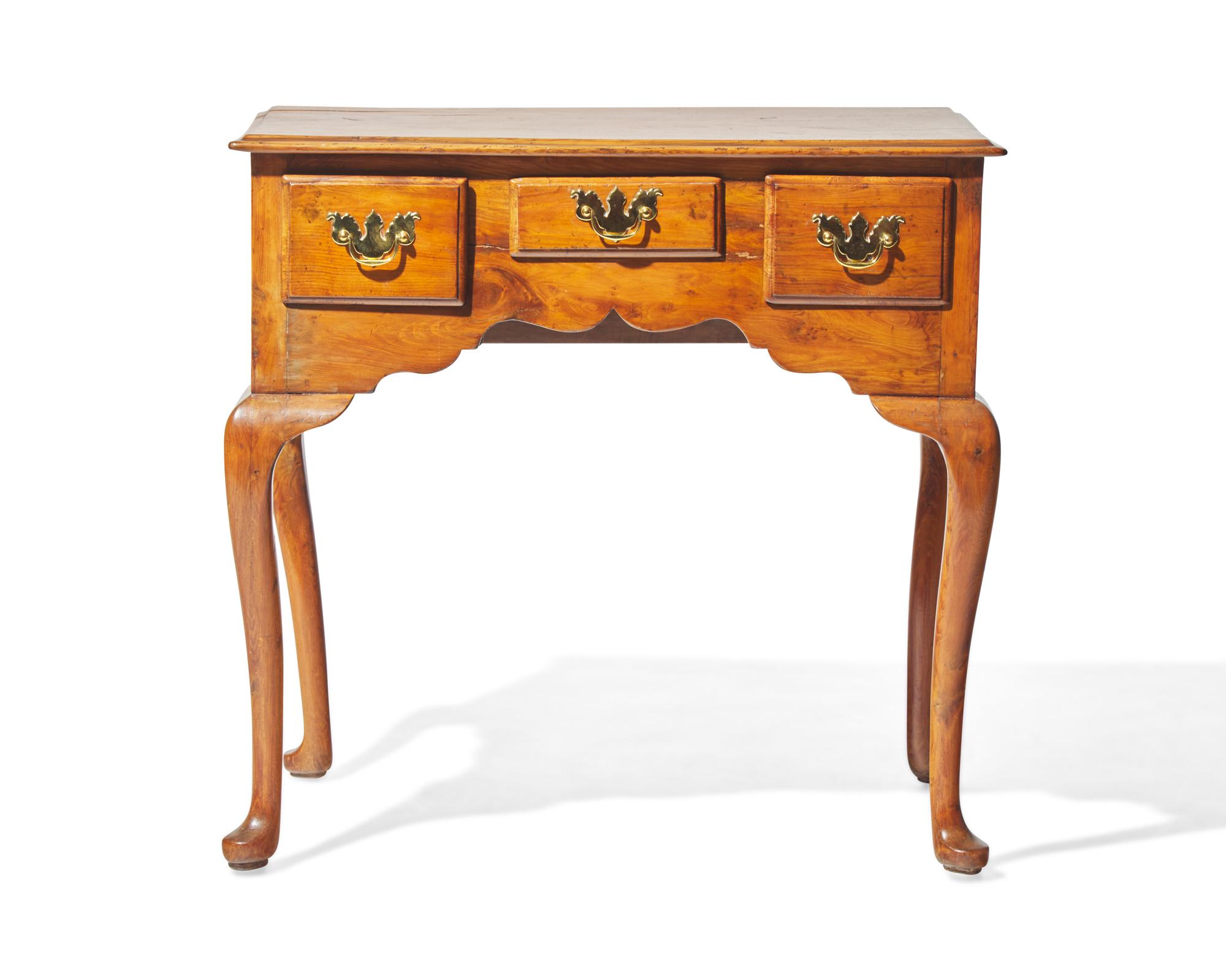 A George II yew dressing table, circa 1750