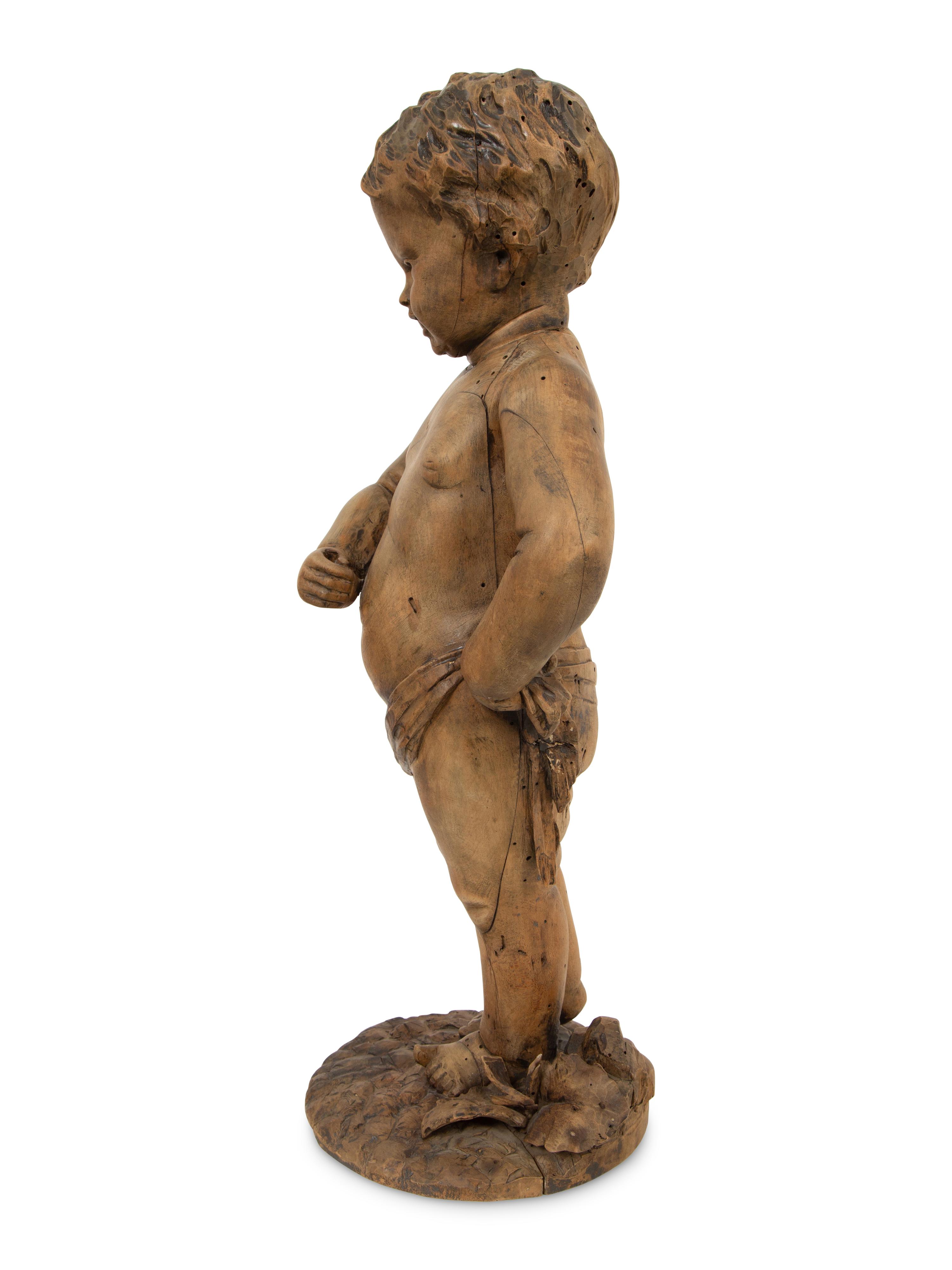 A Flemish Carved Wood Putto