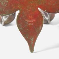 Tiffany Studios (American, active 1878-1932) A Bronze "Fleur de Lis" Two-Light Candelabra with Snuffer, USA, circa 1910