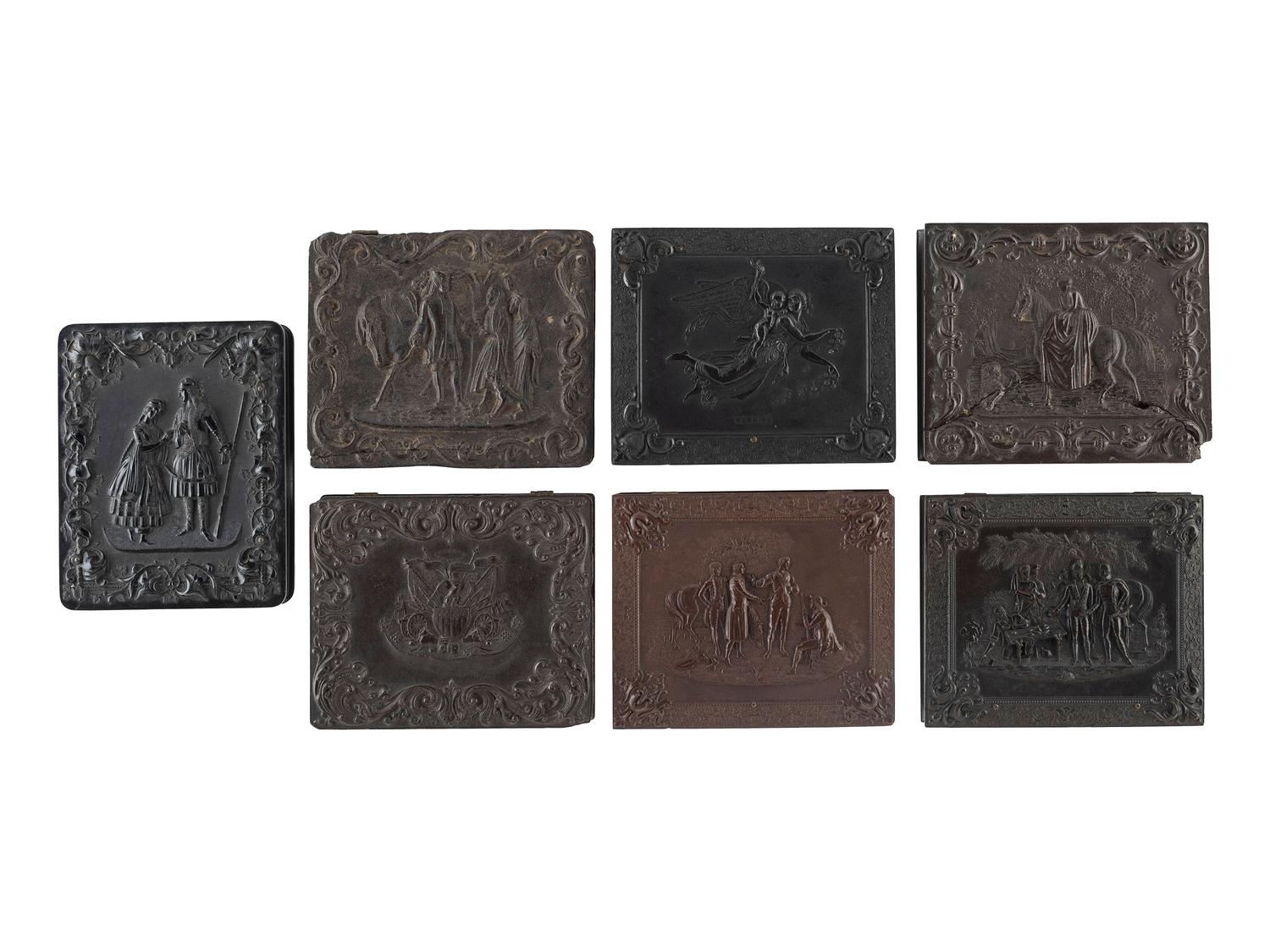 [EARLY PHOTOGRAPHY]. A group of 7 quarter plate Union cases with figural designs, comprising: