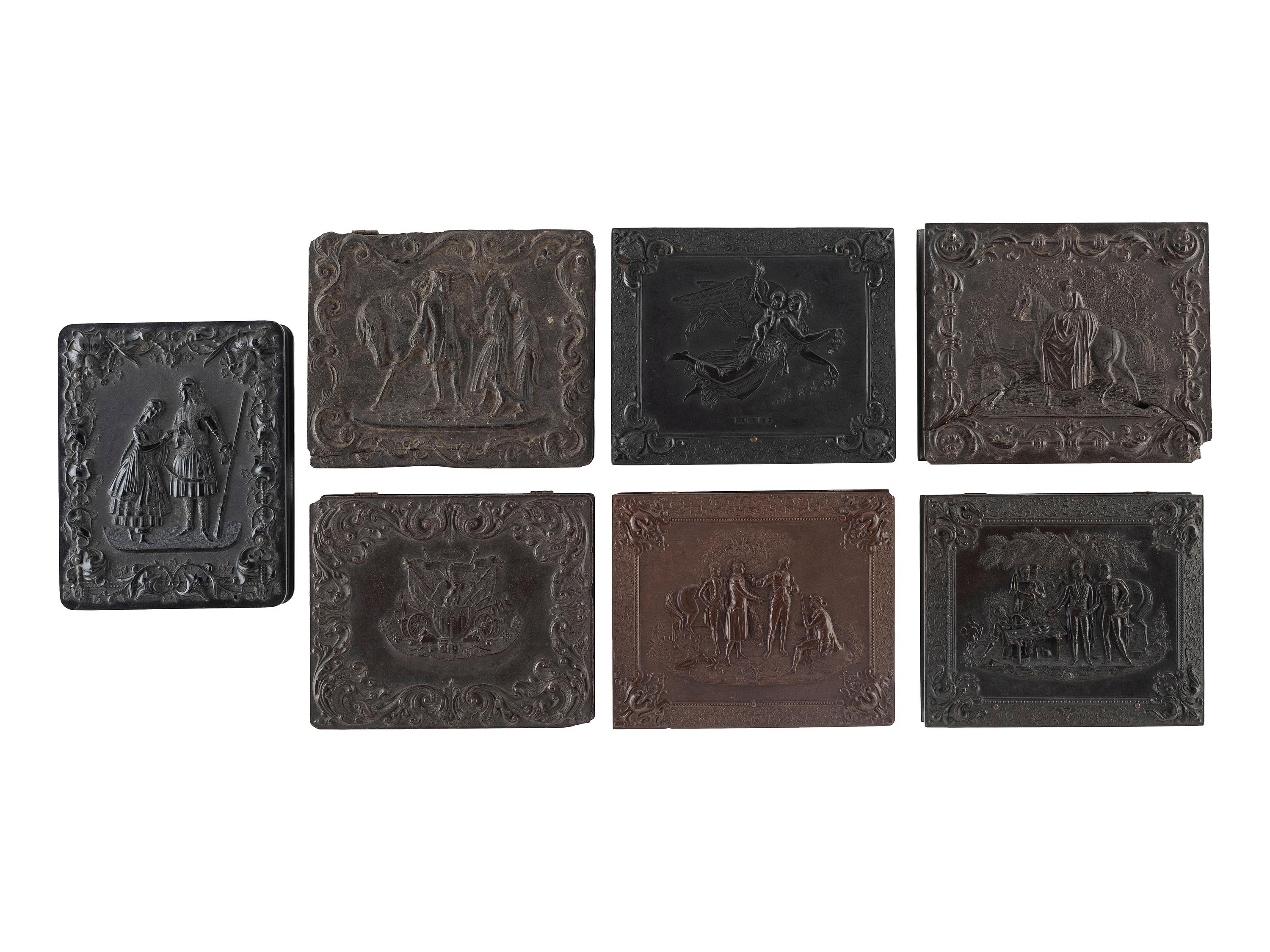 [EARLY PHOTOGRAPHY]. A group of 7 quarter plate Union cases with figural designs, comprising: