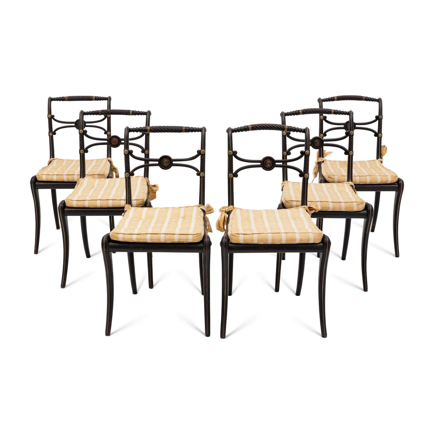 A Suite of Six Regency Ebonized and Caned Dining Chairs