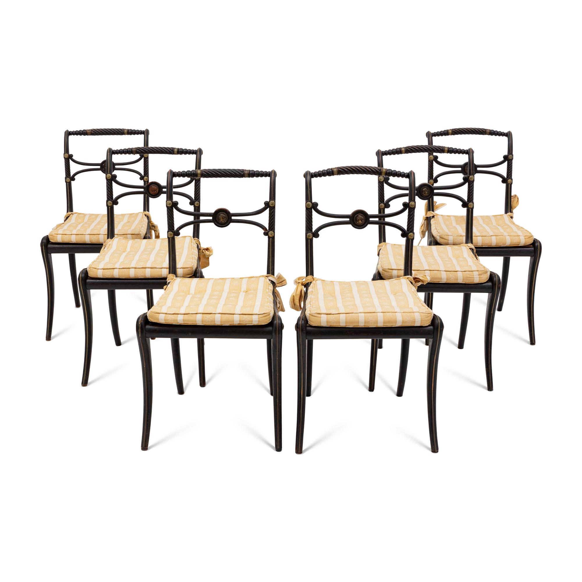 A Suite of Six Regency Ebonized and Caned Dining Chairs