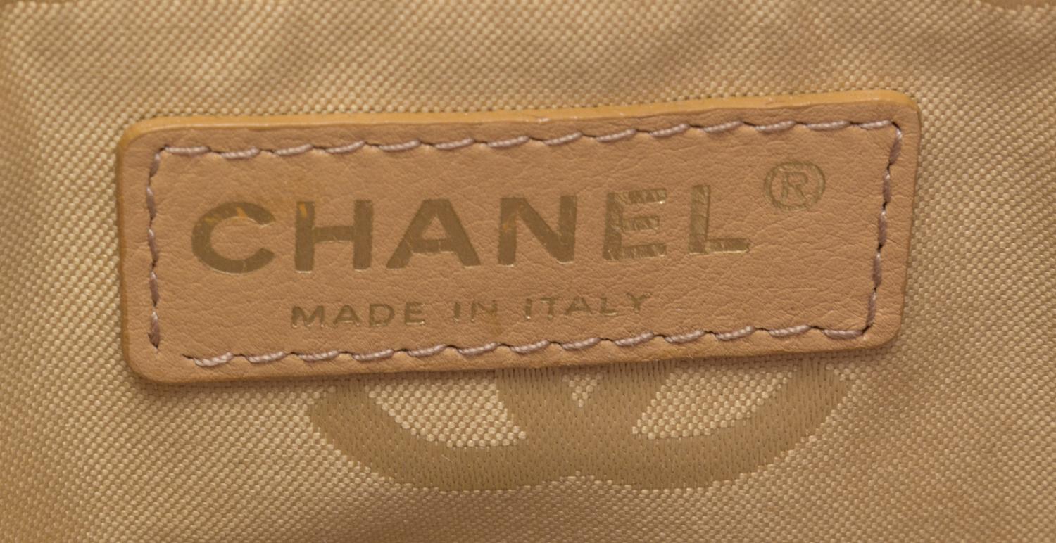 A Chanel Raspberry Caviar Leather Handbag, 12" x 9" x 3".