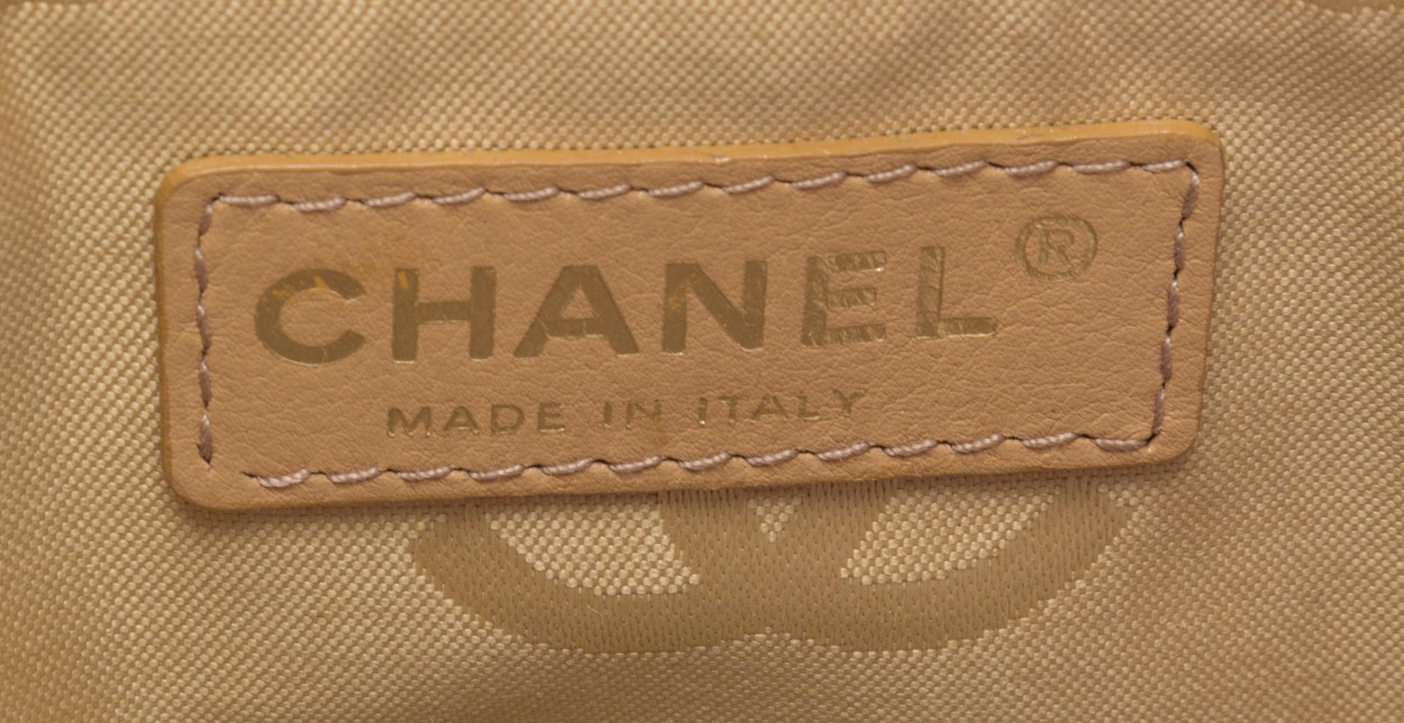 A Chanel Raspberry Caviar Leather Handbag, 12" x 9" x 3".