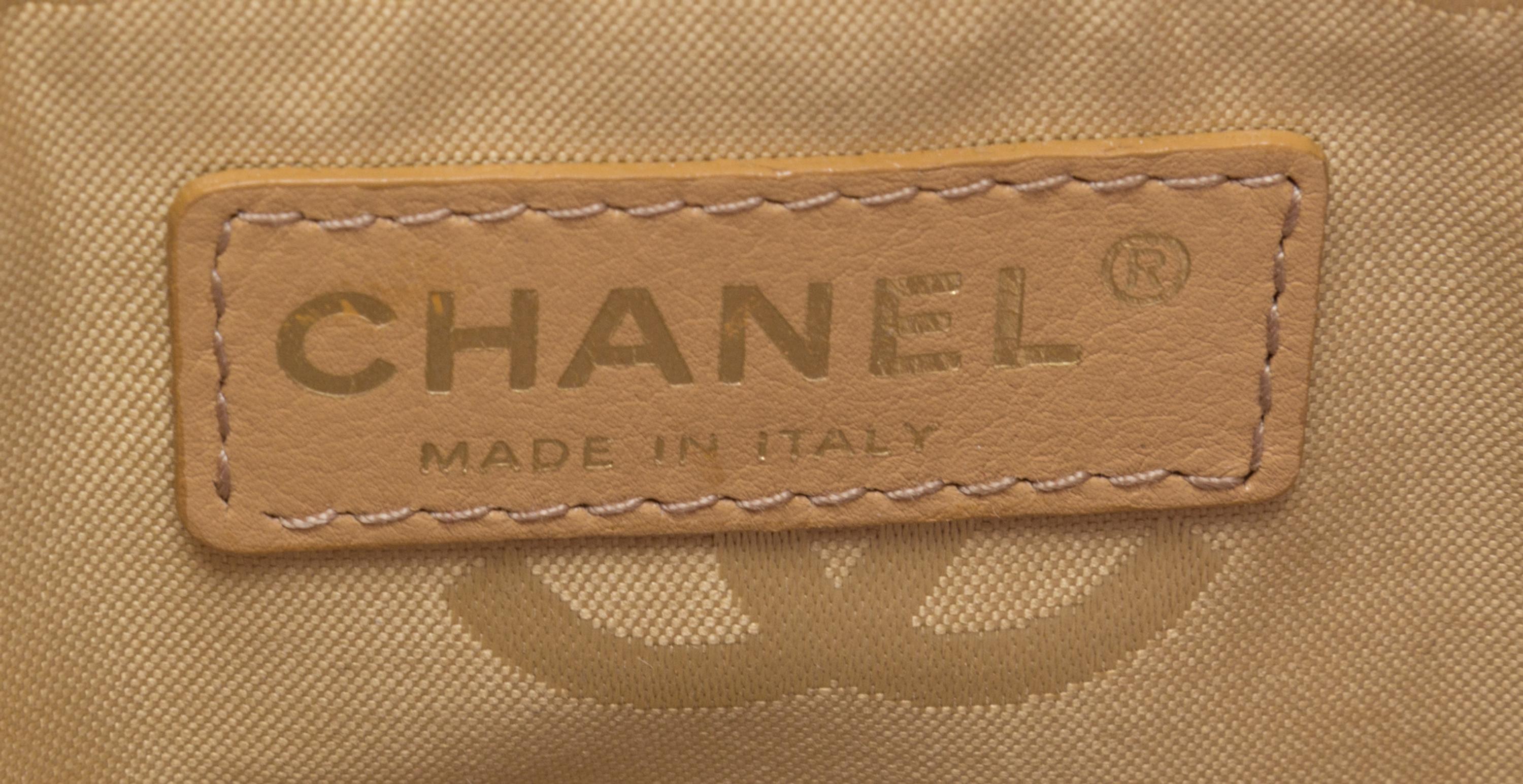 A Chanel Raspberry Caviar Leather Handbag, 12" x 9" x 3".