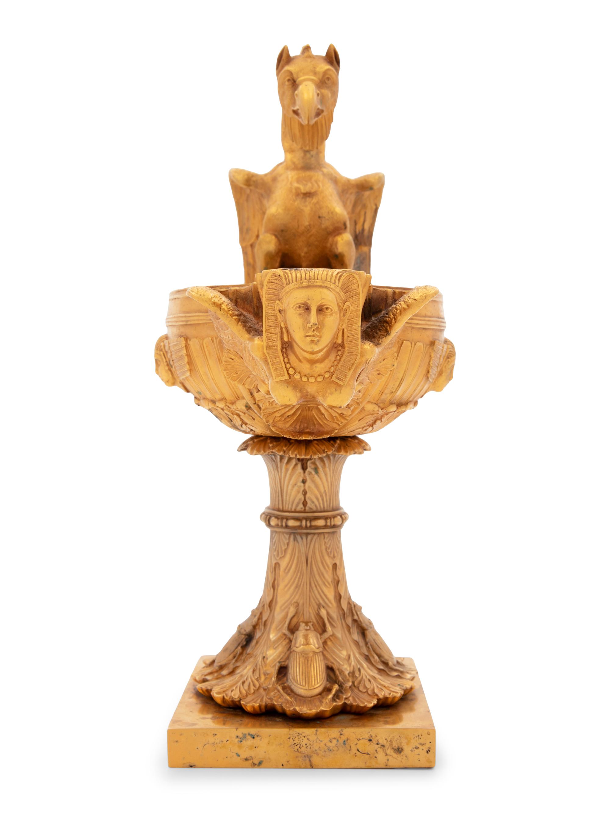 A Continental Gilt Bronze Oil Lamp with a Dragon Handle