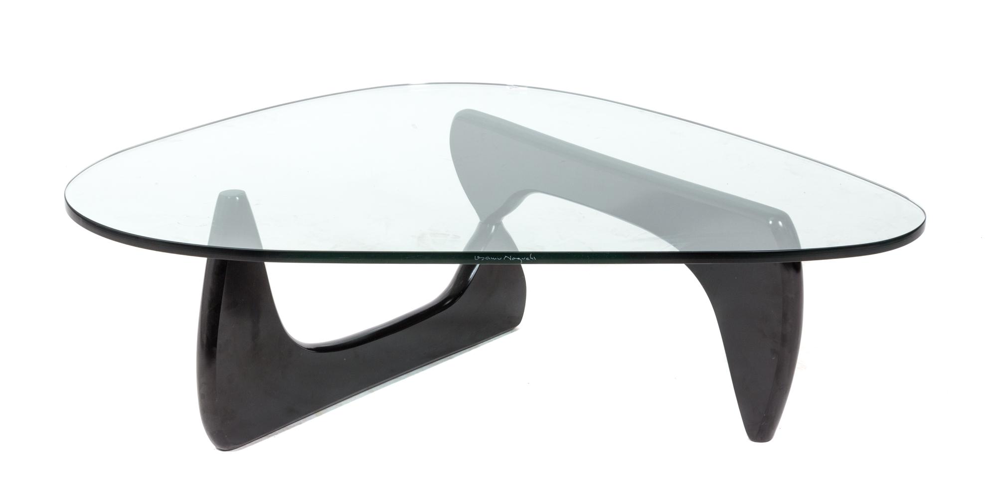 An Isamu Noguchi Low Table Height 15 1/4 x width 50 x depth 35 1/2 inches.