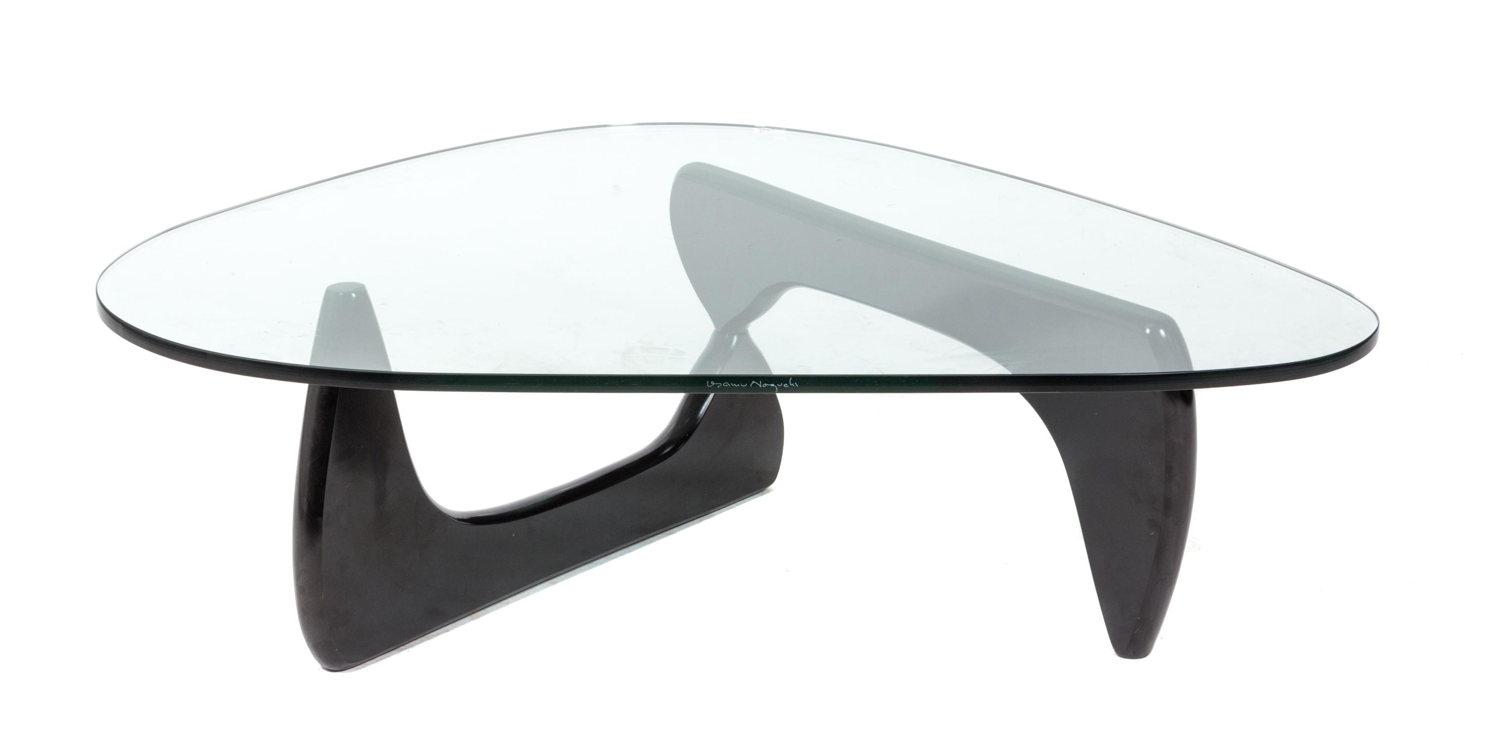 An Isamu Noguchi Low Table Height 15 1/4 x width 50 x depth 35 1/2 inches.