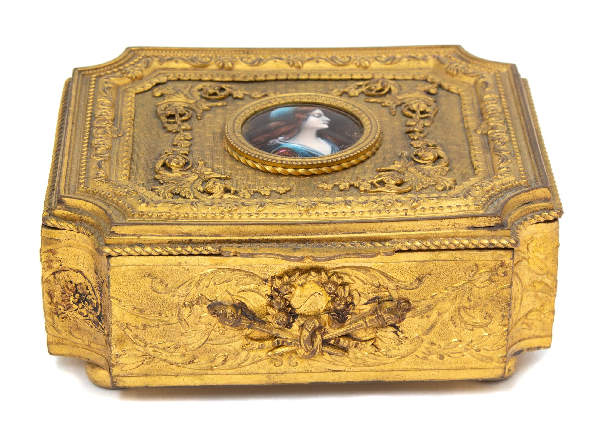 A French Gilt Metal Portrait Jewelry Casket Height 2 1/4 x width 5 1/8 x depth 4 1/2 inches. — 19TH CENTURY