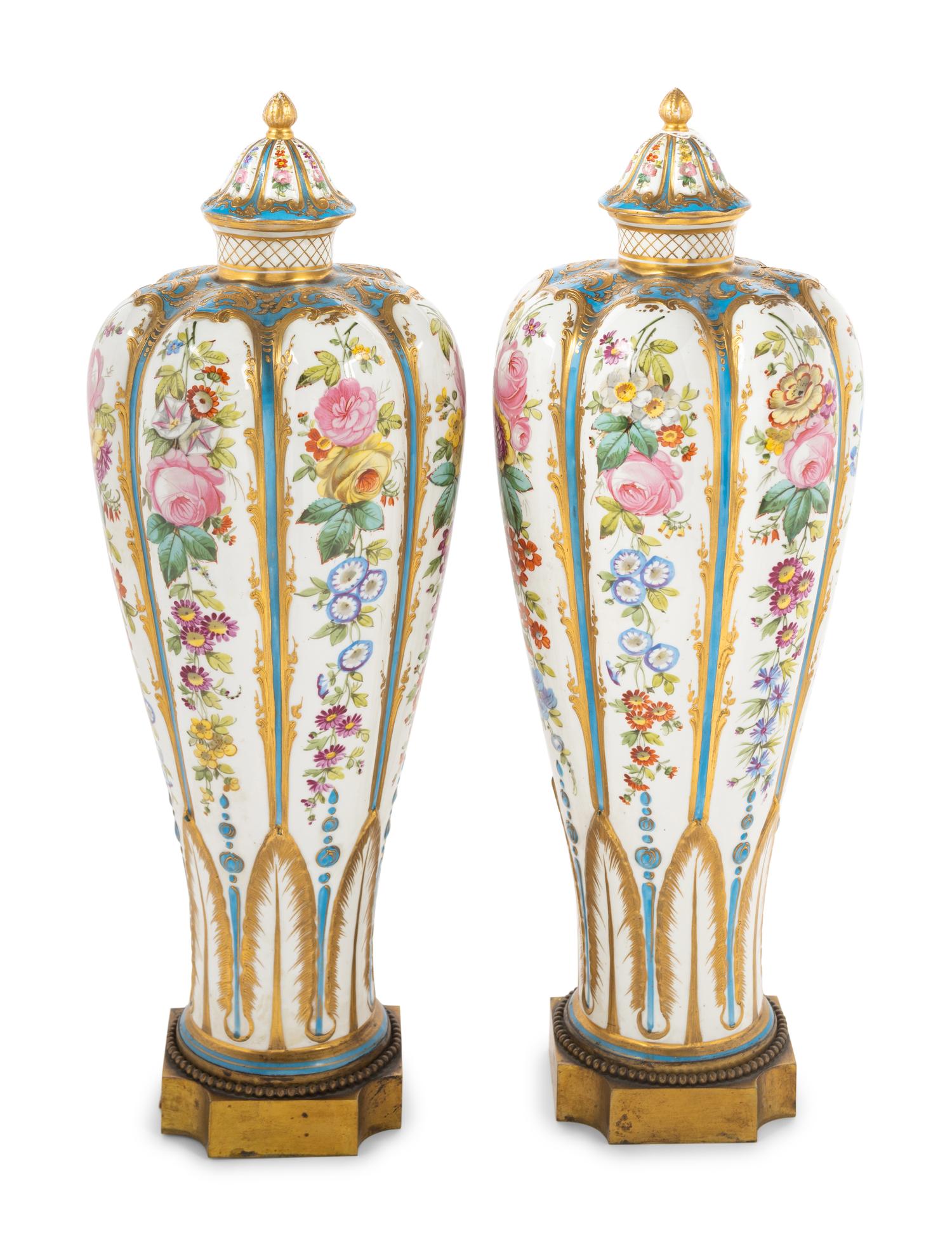 A Pair of Sèvres Style Porcelain Covered Vases