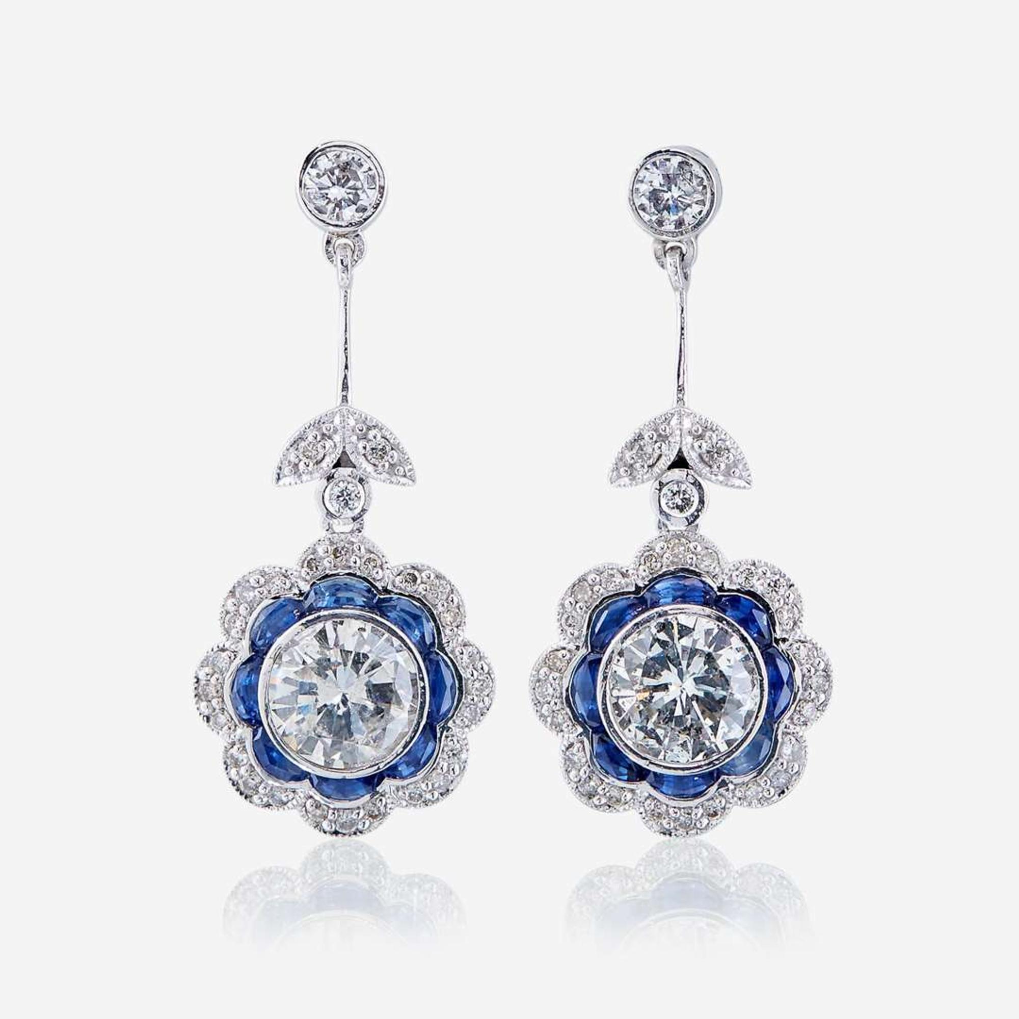 A pair of diamond, sapphire, and platinum earrings