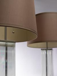 A Pair of Glass and Chromed Steel Table Lamps in the Style of Jean Michel Frank