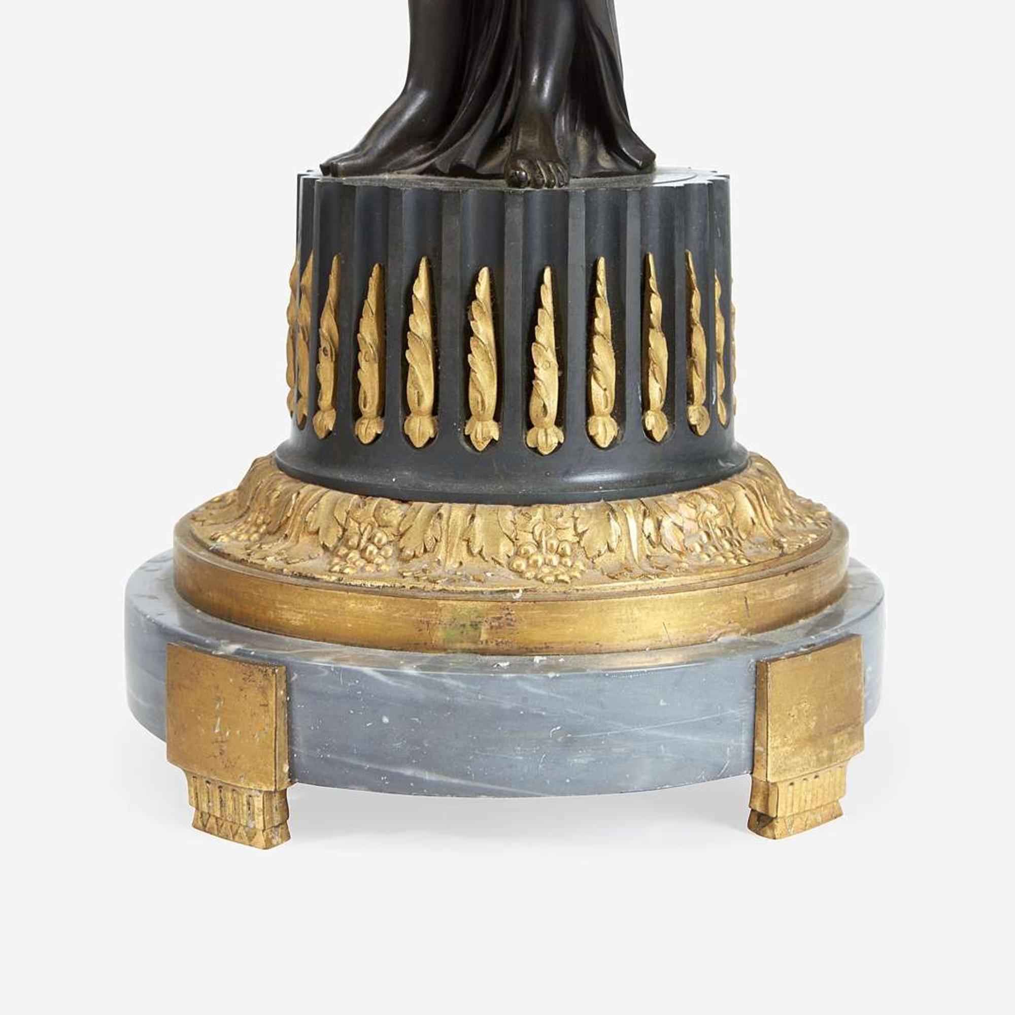 A Pair of Louis XVI Style Gilt and Patinated Bronze Figural Four-Light Candelabra 19th century