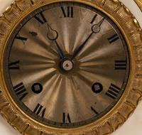 A Louis Philippe Gilt Bronze and White Marble Mantel Clock
