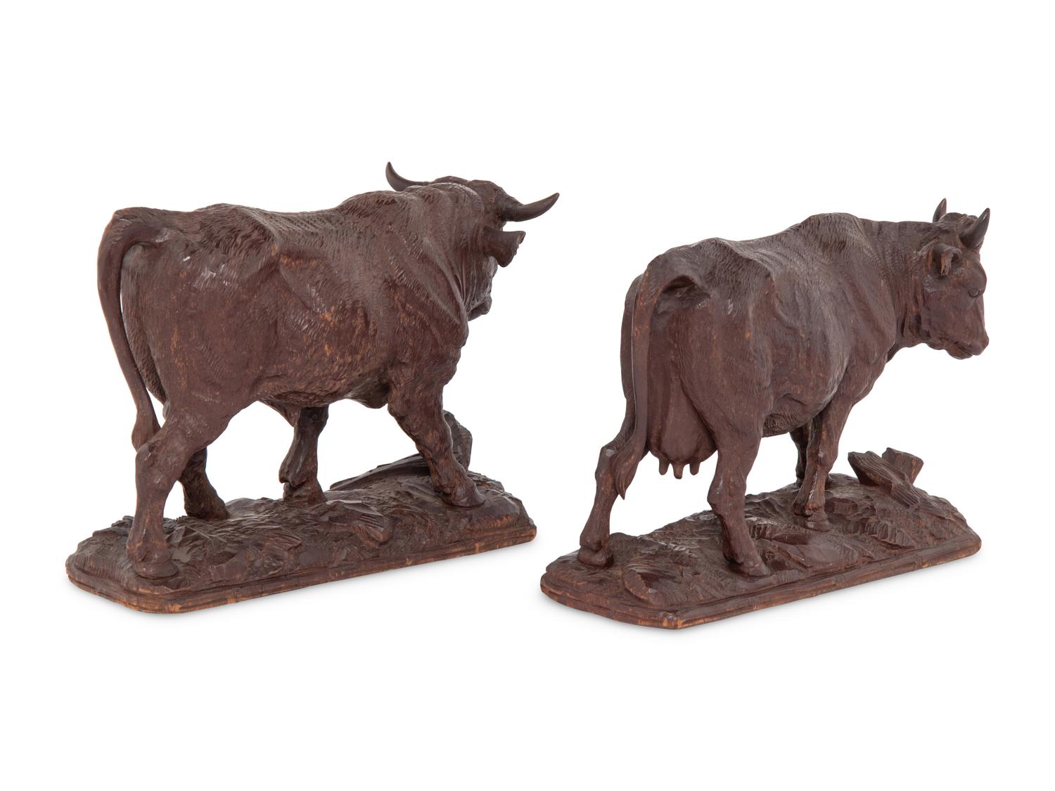 A Pair of Swiss Carved Wood Models of Cattle