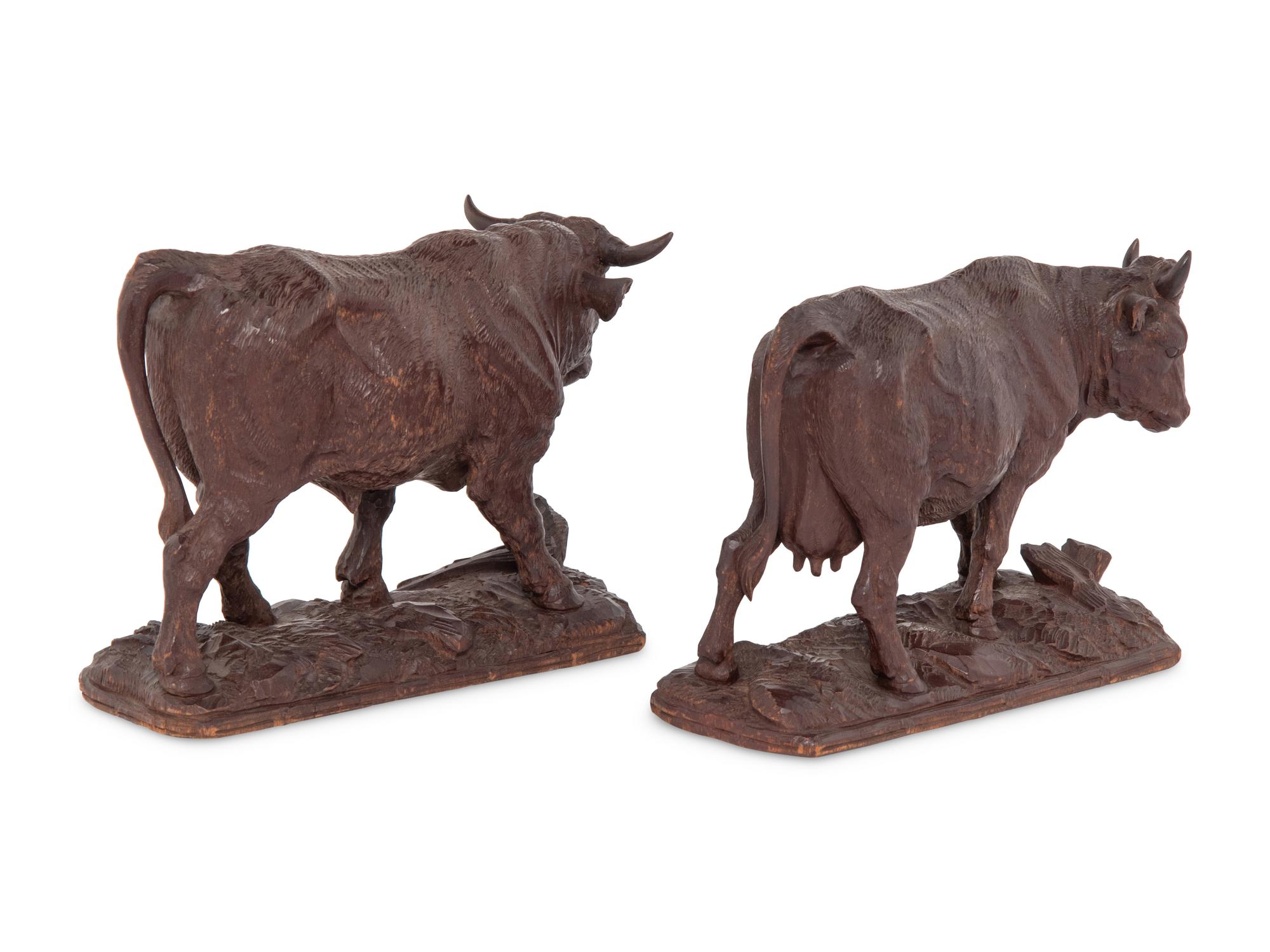 A Pair of Swiss Carved Wood Models of Cattle
