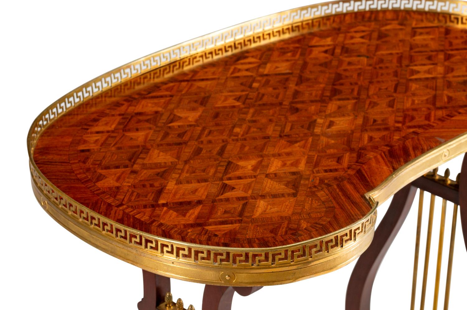 A Louis XVI Style Gilt-Bronze-Mounted Mahogany Kidney-Shaped Table