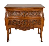 A Louis XV Provincial Style Carved Walnut Commode