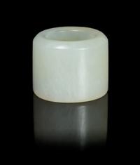 A Pale Celadon Jade Archer's Ring Diameter overall 1 1/4 inches.