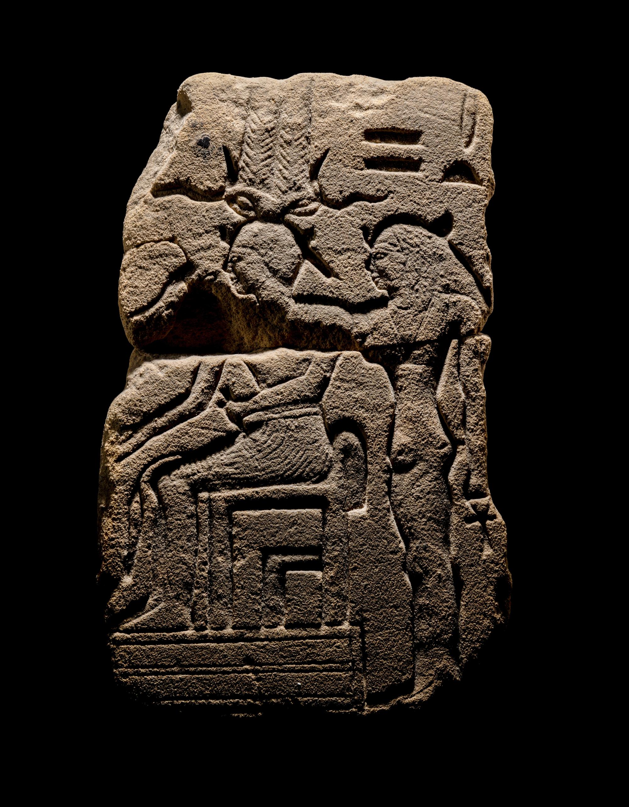 An Egyptian Sandstone Fragment with Osiris and Isis