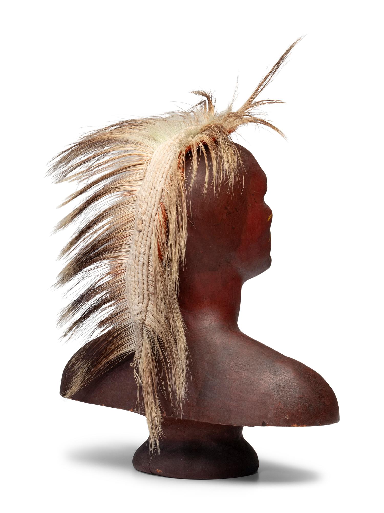 A Carved and Painted Pine Bust of a Native American