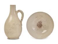 A Chinese, possibly Fujian, Cream Glazed Ewer and a White Glazed Bowl