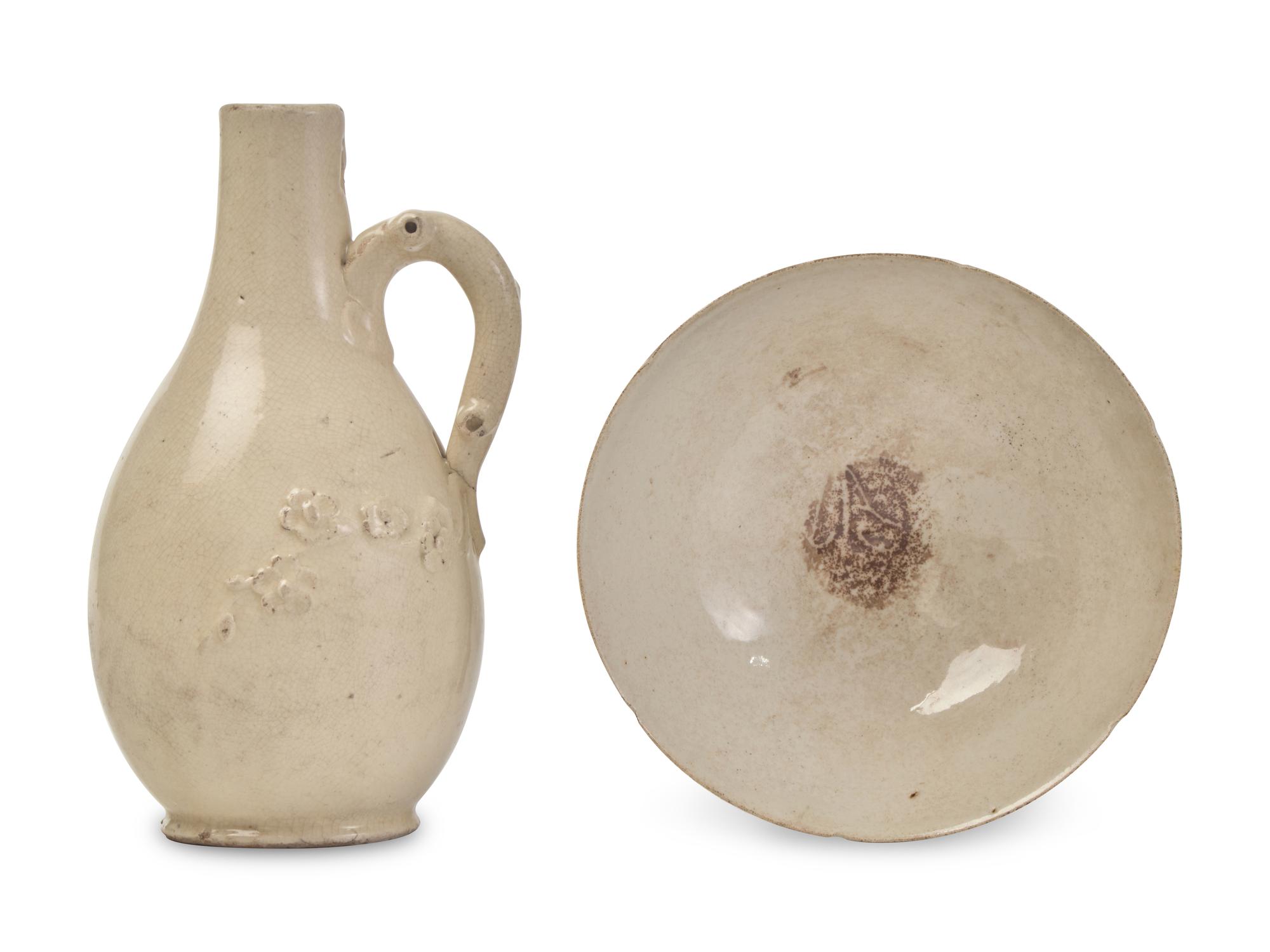 A Chinese, possibly Fujian, Cream Glazed Ewer and a White Glazed Bowl