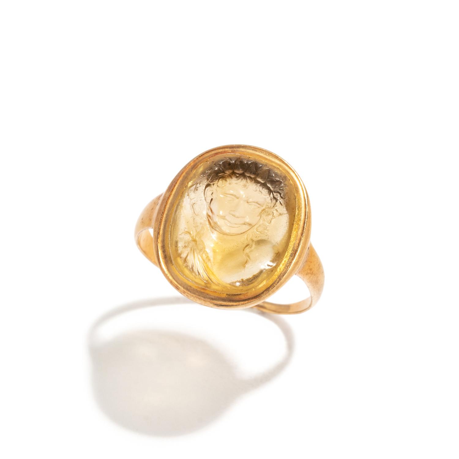 A Roman Citrine Ring Stone with the Bust of a Youthful Satyr — Set in a gold ring